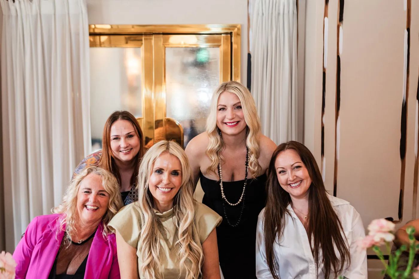Emily Williams posing with a small group of guests in London